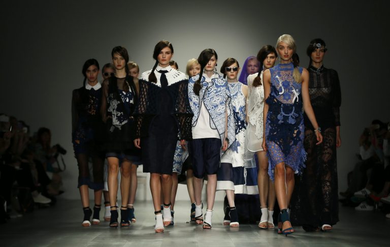 Models wear outfits by designer Bora Asku during his Spring/Summer 2015 show at London Fashion Week in London, Friday, Sept. 12, 2014. (AP Photo/Alastair Grant)