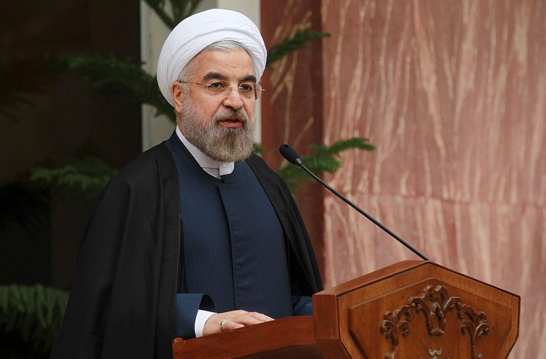 Iran's President Hassan Rouhani speaks during a news briefing after Iran and world powers agree in Geneva to a deal over Iran's nuclear program at the Presidency compound in Tehran, Iran on Sunday. Iran struck a deal agreeing to a temporary freeze of its nuclear program in the most significant agreement between Washington and Tehran in more than three decades. The deal commits Iran to curb its nuclear activities for six months in exchange for limited sanctions relief. (AP Photo/Presidency Office, Mohammad Berno)