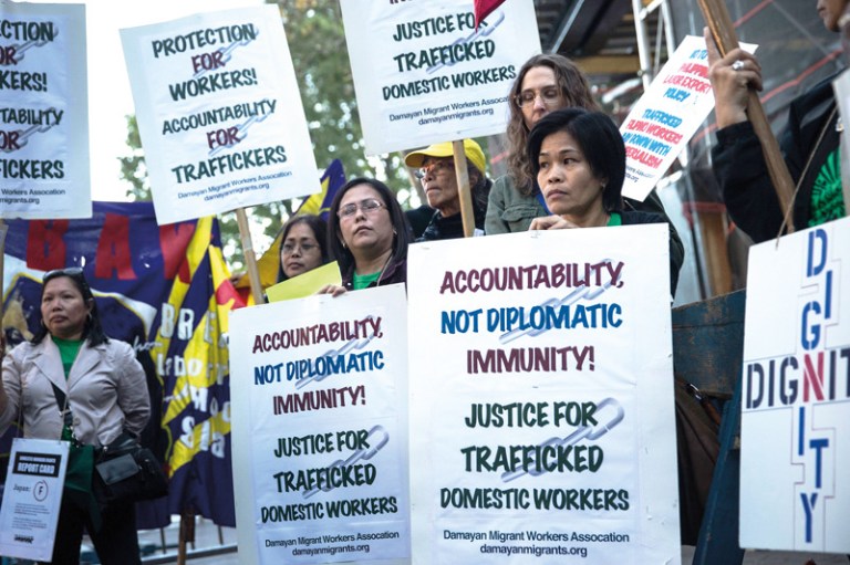 People protest against labor trafficking and modern day slavery outside the United Nations on September 23, 2013 in New York City. (Photo by Andrew Burton/Getty Images)