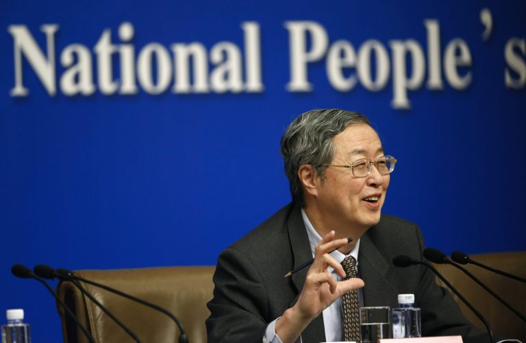 People's Bank of China governor Zhou Xiaochuan speaks at a press conference during the National People's Congress at the media center in Beijing, China, Tuesday, March 11, 2014. Zhou said Beijing might finish the process of easing controls on interest rates within two years and market forces will set the pace for allowing use of its tightly controlled currency abroad.  (AP Photo/Vincent Thian)