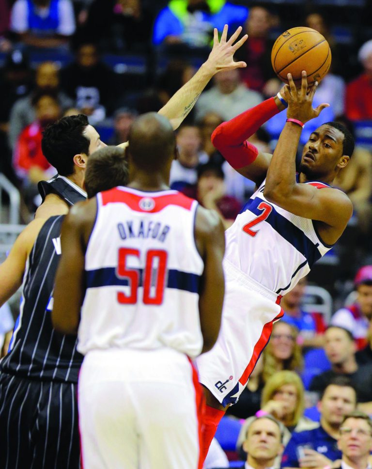 Alex Brandon/AP
Point guard John Wall finished with 12 points and six assists as the Wizards beat the Magic in his second game this season.