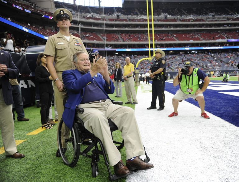 Former President George H.W. Bush arrives at NRG Stadium to help celebrate Salute to Service day before an NFL football game between the Houston Texans and the Detroit Lions, Sunday, Oct. 30, 2016, in Houston. (AP Photo/Eric Christian Smith)