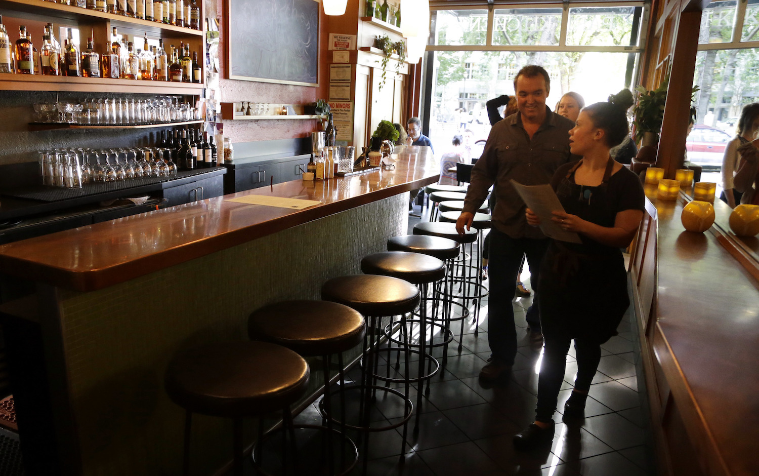 Minimum wage activists call tipping racist