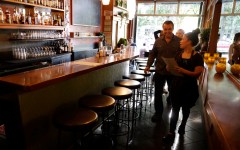 Minimum wage activists call tipping racist