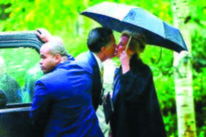 Mitt and Ann Romney on their way to church Sunday. AP Photo.