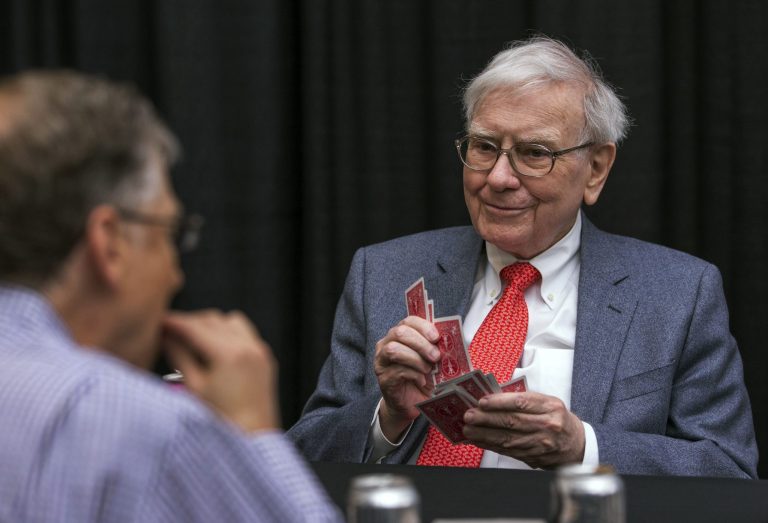 Berkshire Hathaway Chairman and CEO Warren Buffett, right, and Microsoft founder and Berkshire director Bill Gates play bridge outside of the Borsheims jewelry store, a Berkshire Hathaway subsidiary, in Omaha, Neb., Sunday, May 5, 2013. The Berkshire Hathaway shareholders meeting was being held this weekend in Omaha. (AP Photo/Nati Harnik)