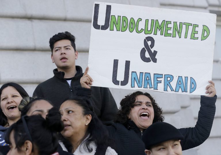 Federal immigration officers launched a blitz of raids across six states on Thursday and Friday. (AP Photo/Jeff Chiu)