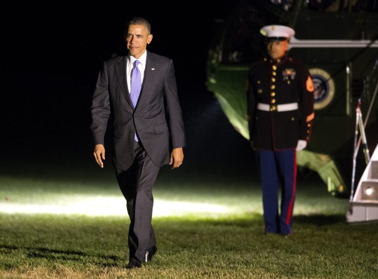 President Barack Obama arrives on the South Lawn of the White House after a day trip to Ohio and Pennsylvania to discuss the economy, and raise campaign money benefiting the Democratic Senatorial Campaign Committee on Thursday, Nov. 14, 2013 in Washington. (AP Photo/ Evan Vucci)