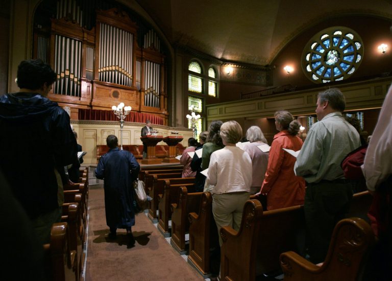 Churchgoers stand at the start of a service at the Mother Church at The First Church of Christ, Scientist in Boston, Wednesday, June 7, 2006. (AP Photo)Â 