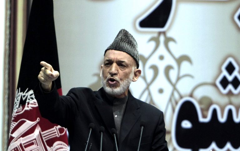 Afghan President Hamid Karzai speaks during the last day of the national consultative council known as a Loya Jirga in Kabul, Afghanistan, Sunday, Nov. 24, 2013. Afghanistan's president says he won't immediately sign a security deal with the United States, ignoring a recommendation by an assembly of Afghan elders and leaders that he do so by the end of the year. (AP Photo/Rahmat Gul)