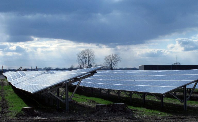 Sunlight streams onto the Maywood Solar Farm in Indianapolis on Tuesday, April 15, 2014. The 8-megawatt solar farm completed last month is the nation's largest solar farm on a federal Superfund site. The 43-acre farm sits on a portion of a 120-acre Superfund site tainted by decades of coal-tar refining and wood-treatment operations. The farm's solar panels feed power into Indianapolis Power & Light's electrical grid. (AP Photo/Rick Callahan)