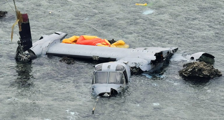 Wreckage of a U.S. military MV-22 Osprey is seen in shallow waters off Nago, Okinawa, after its crash-landing. All five crew members were rescued and three have already been released from Camp Foster Naval Hospital. (Yu Nakajima/Kyodo News via AP)