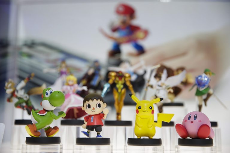 In this June 10, 2014 file photo, amiibo characters for Wii U are on display at the Nintendo booth during the Electronic Entertainment Expo, in Los Angeles. Pikachu and Link will be among the first characters coming to 