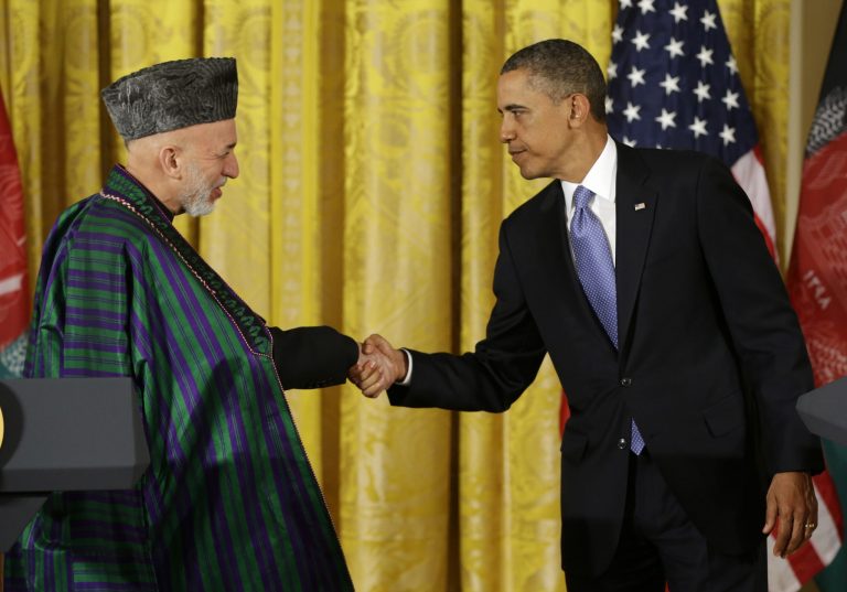 FILE - In this Jan. 11, 2013, file photo, President Barack Obama shakes hands with Afghan President Hamid Karzai at the end of their news conference in the East Room of the White House in Washington. Five years after pledging to remake the U.S. relationship with the broader Middle East and improve America's image in the Muslim world, the Obama administration's regional strategy appears to have come unhinged.  (AP Photo/Pablo Martinez Monsivais, File)