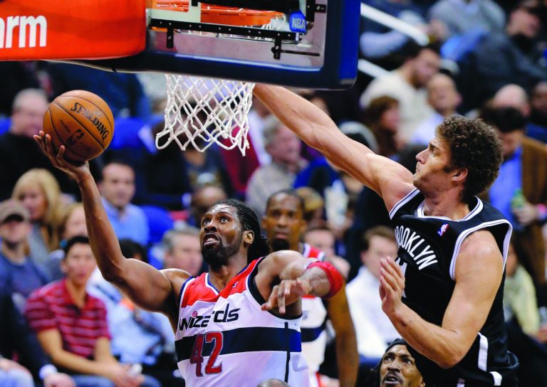 Alex Brandon/AP
Washington center Nene enters Wednesday's game against the Pistons with three straight double-doubles.
