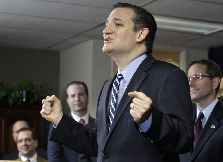 Sen. Ted Cruz, R-Texas, is surrounded by preachers as he addresses a crowd at a Houston church, Thursday, Oct. 16, 2014. (AP Photo/Pat Sullivan)