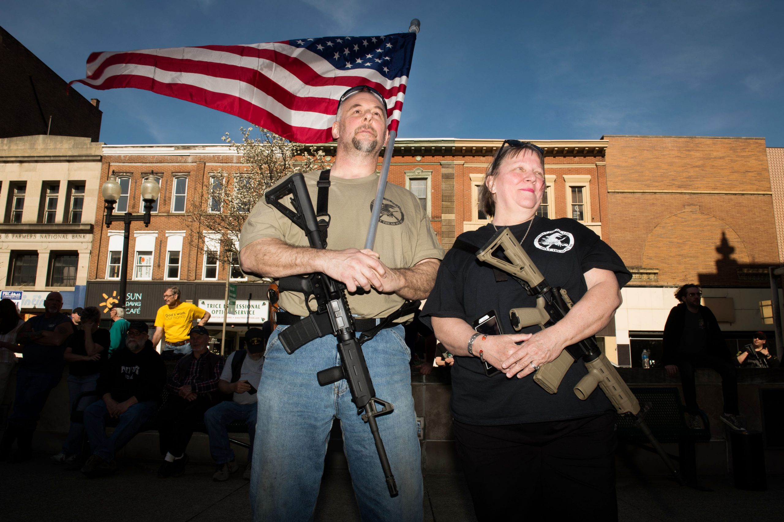 Bill Perkins of Gibsonia, Pa. (left), stands with his wife, Marilyn Boulet, as they carry their AR-15 style rifles at a rally to support Martin Palla and gun rights on April 22 in the courtyard of the Westmoreland County Courthouse in Greensburg, Pa.