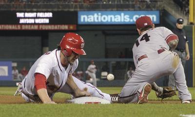 Susan Walsh/AP
Washington Nationals outfielder Bryce Harper, left, went 1-for-3 with an RBI in Thursday night's 2-1 victory over the Arizona Diamondbacks.