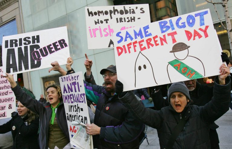 FILE - In a March 17, 2006 file photo, members of the Irish-American gay community protest on Fifth Avenue against the exclusion of Irish and Irish-American gays people from marching in the annual St. Patrick's Day Parade Friday, in New York. Organizers of the world's largest St. Patrick's Day Parade say they're ending a ban and allowing a gay group to march under its own banner for the first time. The parade committee, in a statement made available to The Associated Press, said on Wednesday, Sept. 3, 2014, that OUT@NBCUniversal, a lesbian, gay, bisexual and transgender support group at the company that broadcasts the parade, would be marching up Manhattan's Fifth Avenue on March 17 under an identifying banner. (AP Photo/Dima Gavrysh, File)
