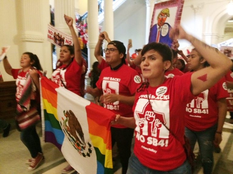 Demonstrators march in the Texas Capitol on Monday, May 29, 2017, protesting the state's newly passed anti-sanctuary cities bill in Austin, Texas. (AP Photo/Meredith Hoffman)