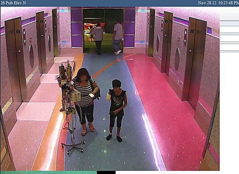   In this hospital surveillance photo released by the Phoenix Police Department on Monday, Dec. 3, 2012, a woman is seen with her 11-year-old daughter, a leukemia patient who had her arm amputated and a heart catheter inserted due to an infection. Authorities say the woman inexplicably took the girl from the hospital last week. Police say that if the catheter is left in too long it could lead to a deadly infection. The familyâs identity is being withheld but they are calling the girl Emily. (AP Photo/Phoenix Police Department)  