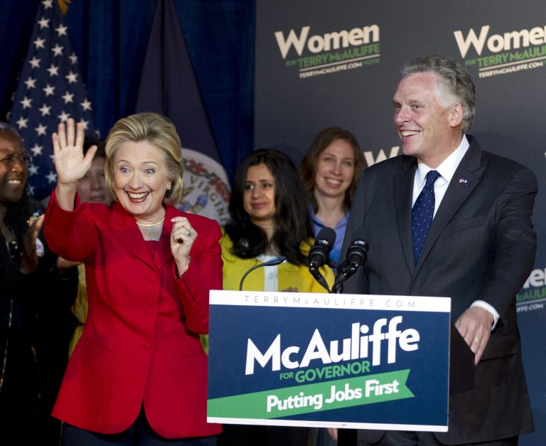 Virginia gubernatorial candidate, democrat TerryÃÂ McAuliffe, right, and former Secretary of State Hillary RodhamÃÂ ClintonÃÂ wave to the crowd during a campaign rally in Falls Church, Va., on Saturday.ÃÂ ( AP/Jose Luis Magana)