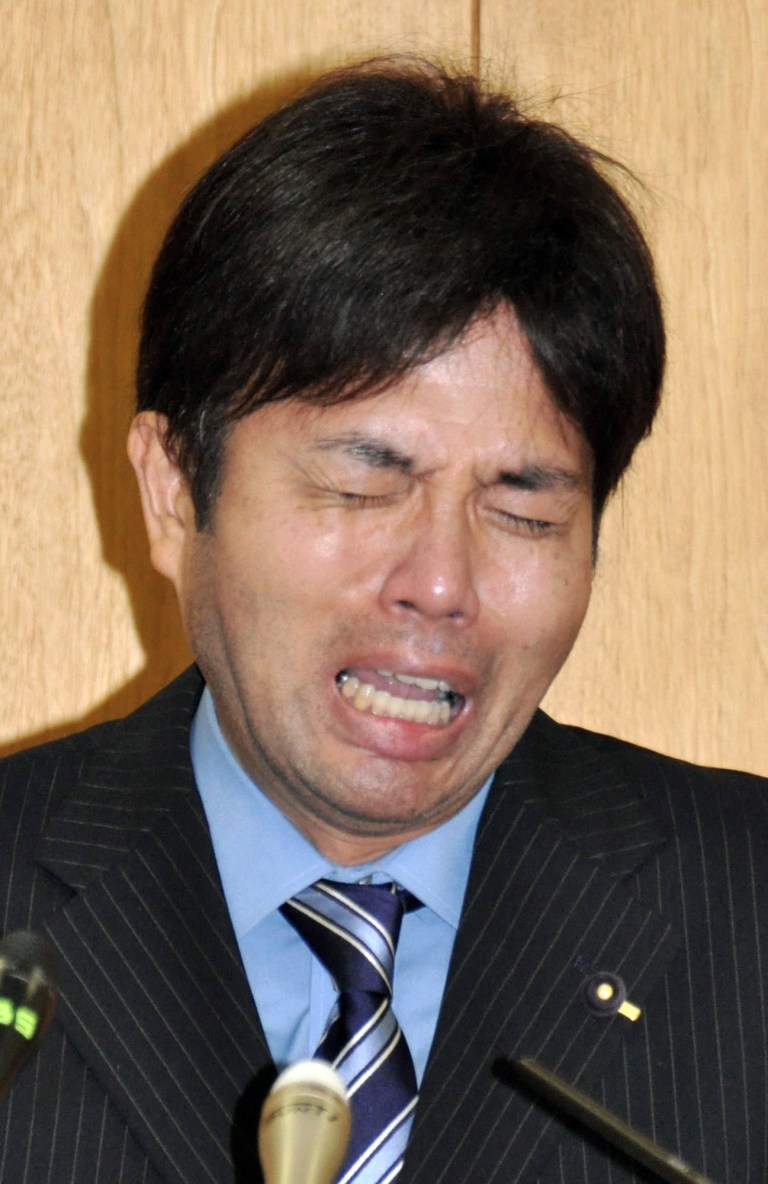In this Tuesday, July 1, 2014 photo, Hyogo Prefectural assemblyman Ryutaro Nonomura cries during a press conference in Kobe, western Japan. A video clip of Nonomura accused of dubious spending has gone viral, leaving many outraged and puzzled. The video shows Nonomura, 47, bursting into tears, uttering nonsensical phrases and banging on the desk. One site for the video drew nearly 640,000 views, as of Thursday. (AP Photo/Kyodo News) JAPAN OUT, MANDATORY CREDIT