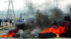 SAfrican police fire gas, force people into shacks