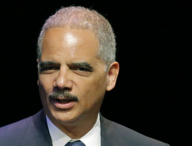FILE - This April 17, 2014 file photo shows Attorney General Eric Holder speaking in Overland Park, Kansas. Student lender Sallie Mae has reached a $60 million settlement with the federal government to resolve allegations it charged military service members excessive interest rates on their student loans. The settlement was announced Tuesday Holder and Education Secretary Arne Duncan. (AP Photo/Orlin Wagner, File)