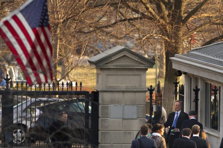 Tech company CEO's including Google CEO Eric Schmidt, center of group in blue tie, walk to exit the Soutwest Gate of the White House after meeting with President Barack Obama at the White House in Washington, Friday, March 21, 2014. (AP Photo/Jacquelyn Martin)