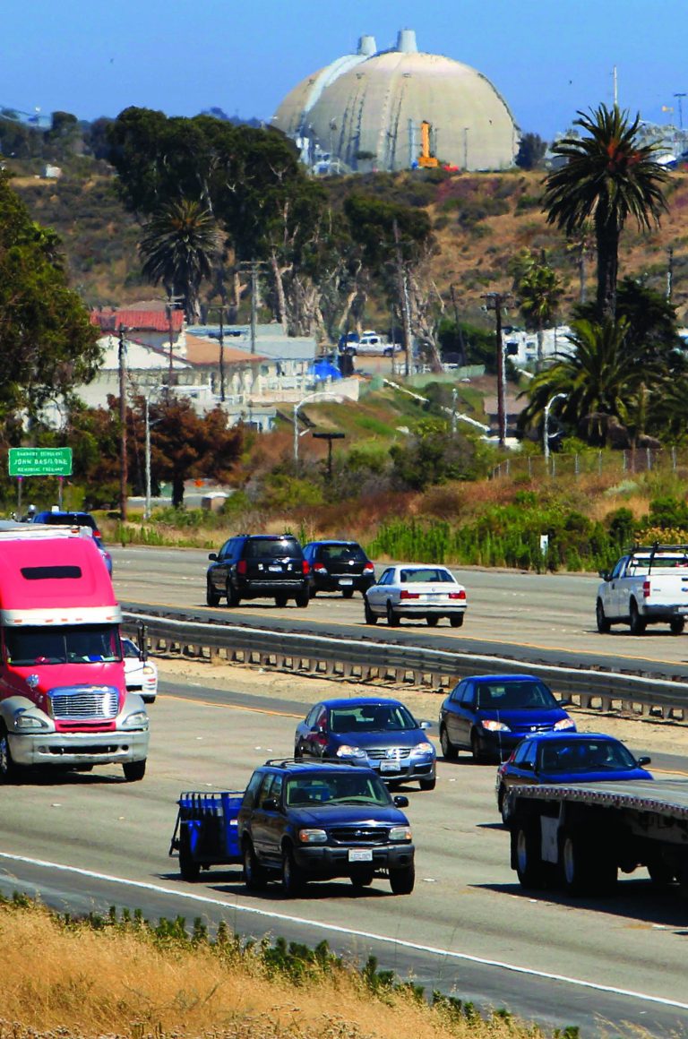 FILE - In this Thursday, June 30, 2011 file photo, a steady flow of traffic on Interstate 5 runs past the San Onofre Nuclear Generating Station in San Clemente, Calif. Corporate offiicials are expected to release Q2 financials for Edison International, which should show how much the company has burned on replacement power during the continuing shutdown and what the possible repair bill might be. Several months ago the company said it burned $30 million on replacement power through March 31, and projected the repair bill at $65 million. (AP Photo/Lenny Ignelzi, File)