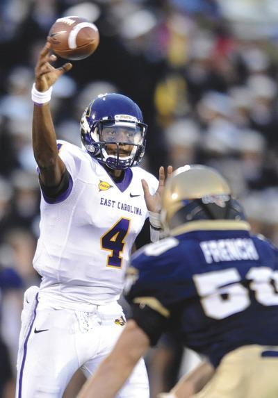 Gail Burton/AP
ECU quarterback Dominique Davis completed his first 26 passes against Navy, the most in a row in a game in NCAA history.