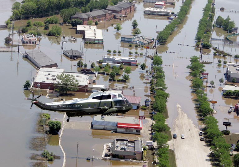 Marine One flies over flooded areas of Coralville, Iowa, as President Bush surveys damage from flooding in the Cedar Rapids and Iowa City areas on June 19, 2008. (AP/Liz Martin)