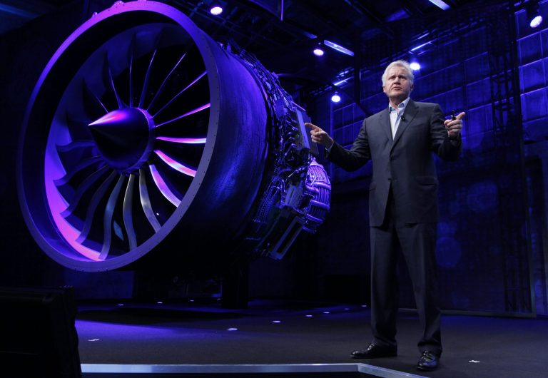 FILE - In this Nov. 29, 2012 file photo provided by General Electric, GE CEO and Chairman Jeff Immelt, stands in front of a jet engine during the Mind + Machines 2012 event in San Francisco. The sale of the company's appliance division, announced Monday, Sept. 8, 2014, is the latest in a long string of moves by GE to shift its focus away from consumers and toward the manufacturing of giant, complex industrial machines such as aircraft engines, locomotives, gas-fired turbines and medical imaging equipment. (AP Photo/General Electric, File)