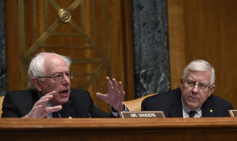 Senate Budget Committee ranking member Sen. Bernie Sanders, I-Vt., left, talks as committee chairman Sen. Michael Enzi, R-Wyo., right, listens during opening remarks before testimony from Office of Management and Budget Director Shaun Donovan on Capitol Hill in Washington, Tuesday, Feb. 3, 2015, during a hearing to examine the President's proposed budget request for fiscal year 2016. (AP Photo/Susan Walsh)