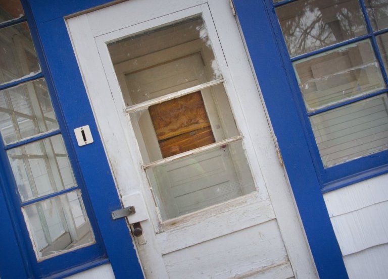 A house in Manitou Springs is seen in January with broken and boarded-up windows after a suspected hash oil explosion in May. (The Gazette)