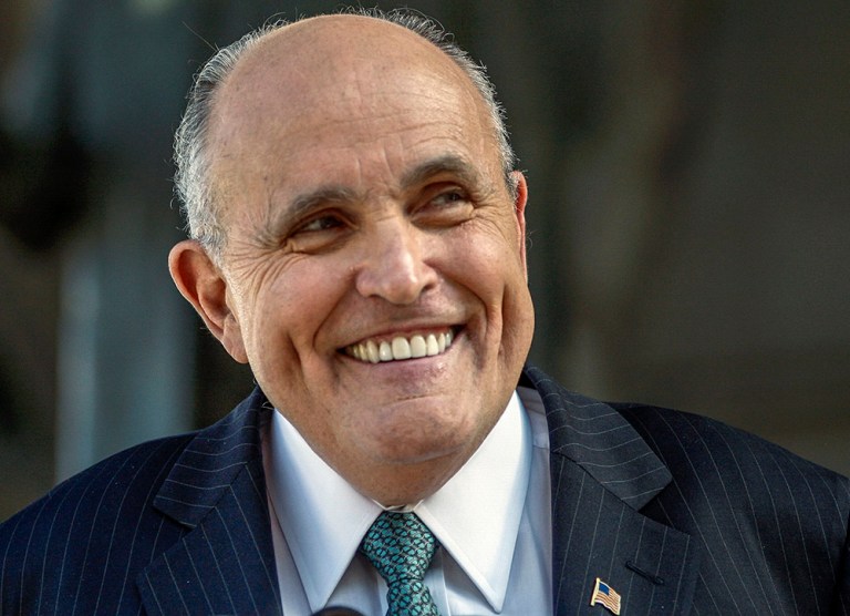 The former mayor of New York shares his pick between the two front-runners. (AP Photo/Damian Dovarganes, File)