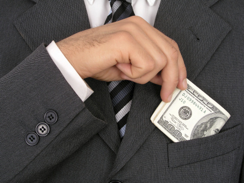 Washington creates corporate welfare programs that hand taxpayer money to companies for things like exporting, building windmills or hiring people. Corporations love this free cash, and they lobby to preserve it. Then Washington places conditions on this cash, thus helping steer corporations to do what politicians want them to do. (Photo: Thinkstock)