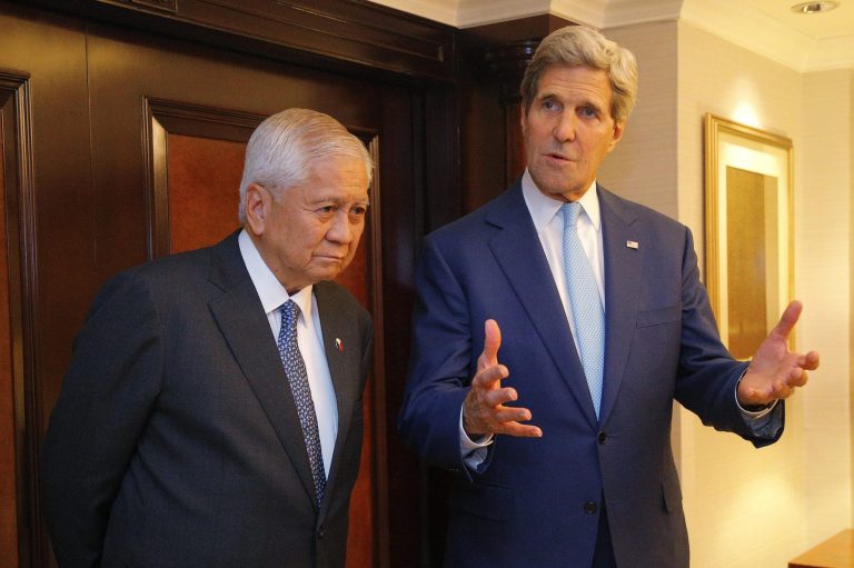 U.S. Secretary of State John Kerry, right, answers a question from a reporter during a meeting with Philippine Foreign Minister Albert del Rosario, in Jakarta, Monday, Oct. 20, 2014. (AP Photo/Brian Snyder, Pool)