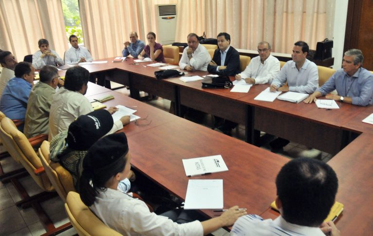   FILE - In this Nov. 19, 2012 file picture released by Colombia's government's delegation, representatives from the government's negotiation team, right, sit across the table from representatives of the Revolutionary Armed Forces of Colombia, or FARC, negotiation team on the first day of peace talks in Havana, Cuba. While the angry rhetoric and bombs continue to fly back home, Colombian rebels and government negotiators in peace talks in the Cuban capital describe an increasingly collegial atmosphere and growing trust between otherwise mortal enemies. (AP Photo/Omar Nieto Remolina, Government of Colombia, File)  