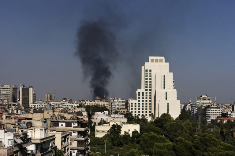 Black columns of smoke rise from heavy shelling in the Jobar neighborhood of Syria on Sunday. (AP/Hassan Ammar)