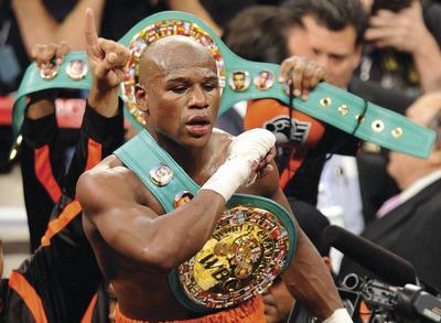 Ethan Miller/Getty Images
Floyd Mayweather won the WBC welterweight title after a controversial knockout.