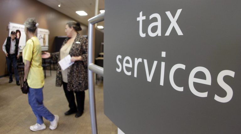 With Americans rushing to file their income tax returns by April 18. (AP Photo/Mark Humphrey)