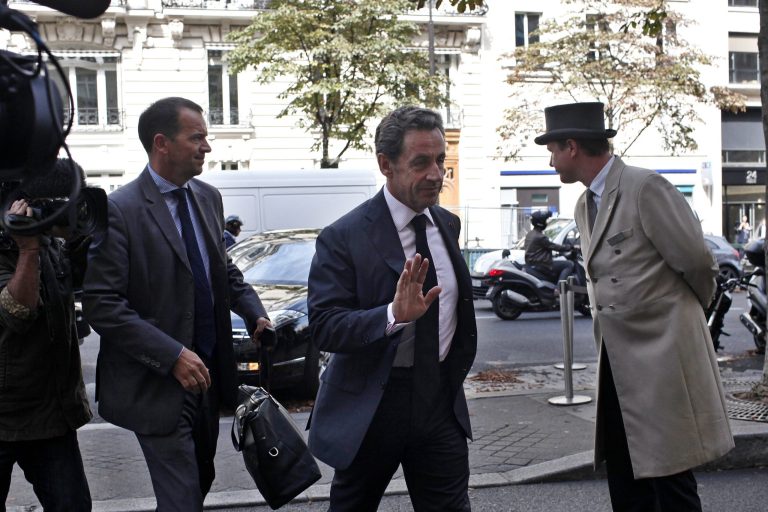 Former French President Nicolas Sarkozy arrives at an hote in Paris, Friday, Sept. 19, 2014. Sarkozy is expected to announce his political come-back this weekend. (AP Photo/Thibault Camus)