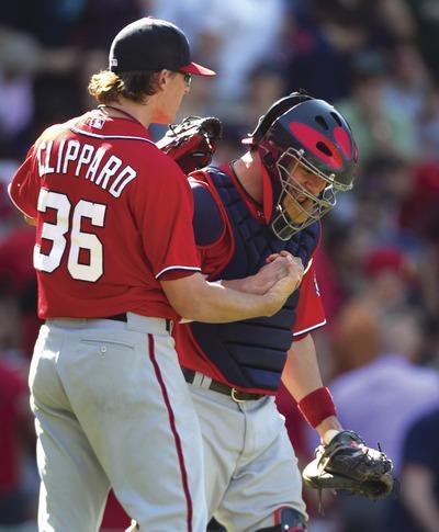 Steven Senne/AP
Tyler Clippard and Jesus Flores