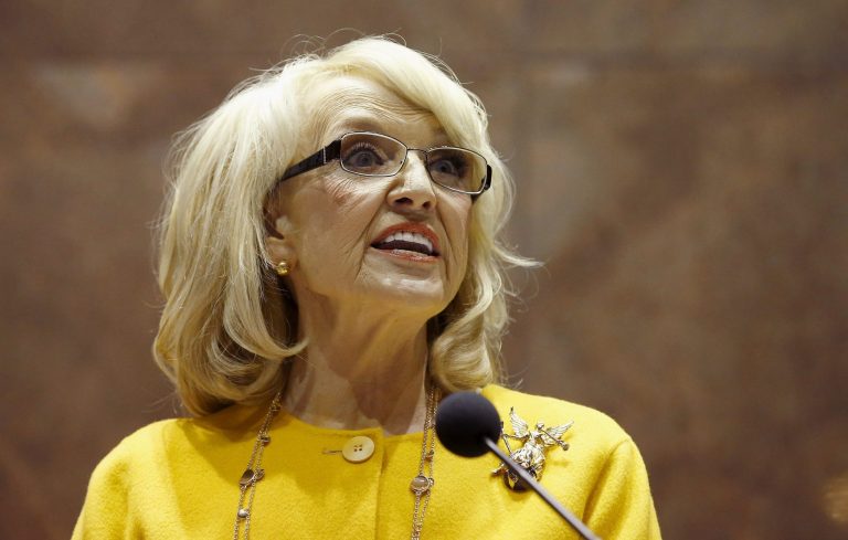 Arizona Gov. Jan Brewer looks out over the assembled legislature during her State of the State address in the Arizona House of Representatives at the Arizona Capitol Monday, Jan. 13, 2014, in Phoenix. Brewer is among eight Republican governors whose states have enacted Medicaid expansion. (AP Photo/Ross D. Franklin)