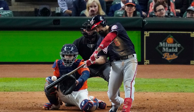 Washington Nationals' Anthony Rendon hits a home run against the Houston Astros during the seventh inning of Game 7 of the baseball World Series Wednesday, Oct. 30, 2019, in Houston.