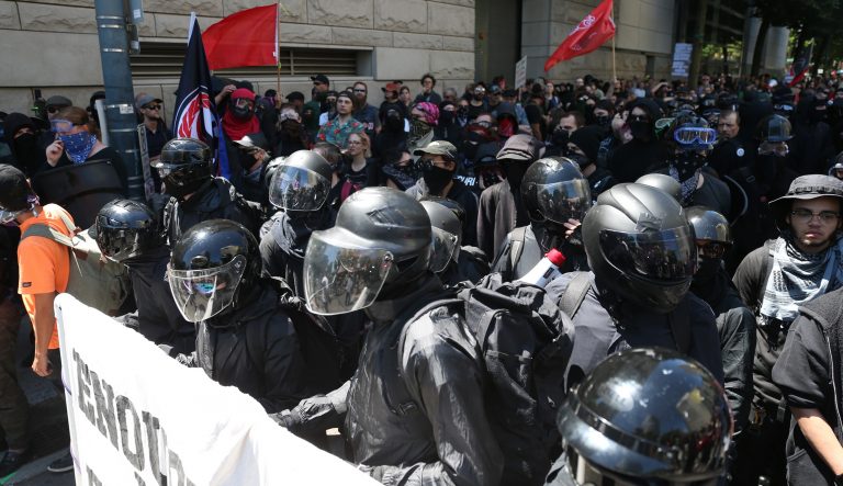 Multiple groups, including Rose City Antifa, the Proud Boys and conservative activist Haley Adams protest in downtown Portland, Ore., Saturday, June 29, 2019.