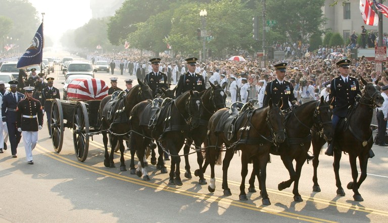 Former President Ronald Reagan's casket is carried on a horse-drawn caisson en route to the U.S. Capitol in Washington, D.C., Wednesday, June 9, 2004.