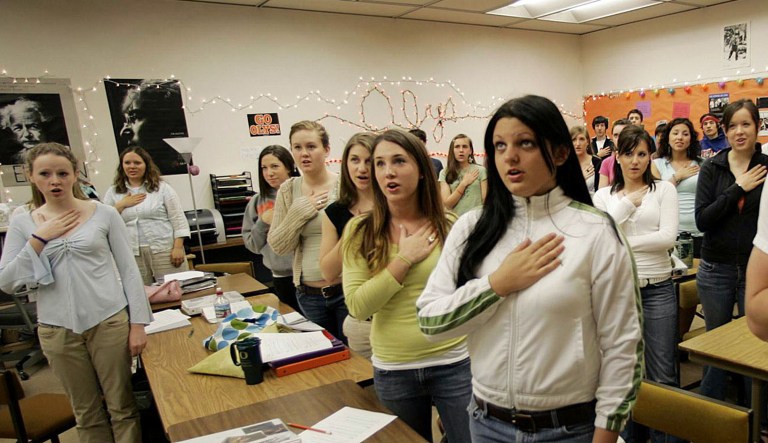 Sprague High School students, prompted by their teacher, rise to their feet, place their hand over their heart and recite the Pledge of Allegiance Wednesday, April 28, 2005, in Salem , Ore. The 10-second ritual is practiced on a weekly basis in public schools throughout Oregon, but it could become a daily occurrence if Republican legislators have their way.